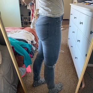 Free people “washed black” jeans with holes in knee. Size 26. Great condition.